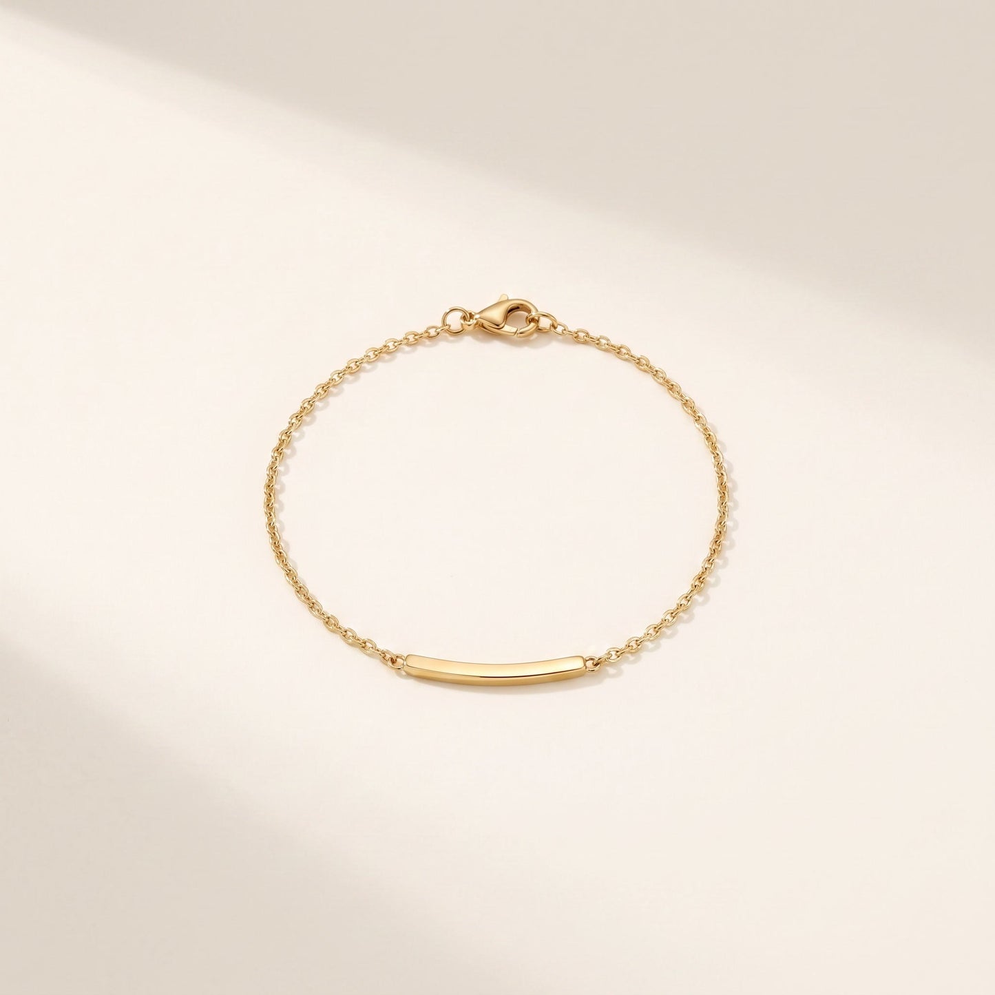 Bracciale Filo: catena sottile con barretta lucida e moschettone, acciaio 316L PVD oro