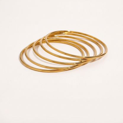 Set Mira: cinque bracciali rigidi dorati da 6 cm di diametro